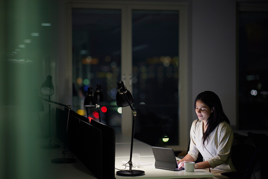 Woman working late in office