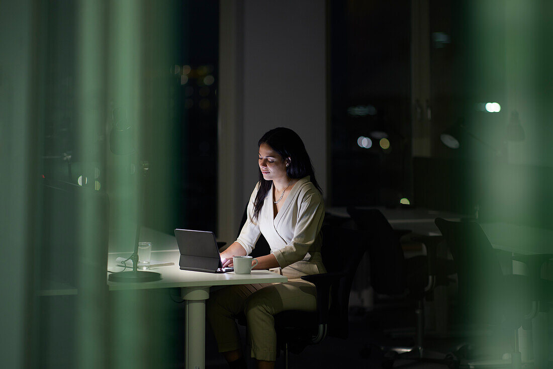 Woman working late in office