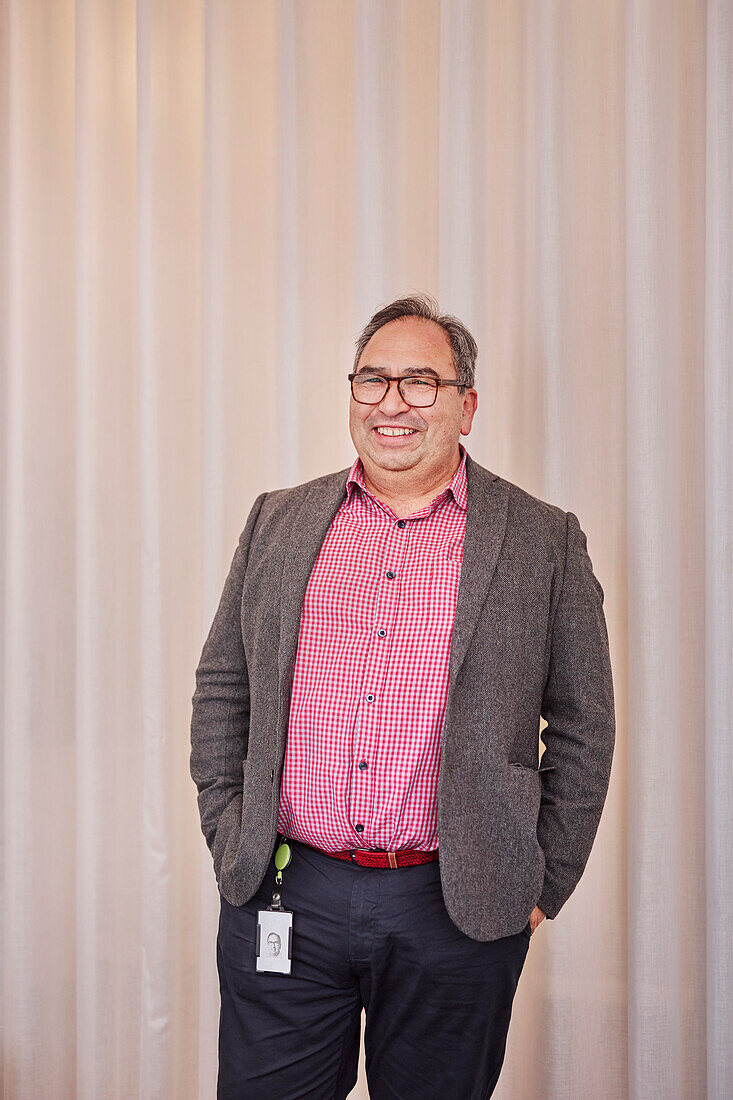 Smiling businessman looking at camera