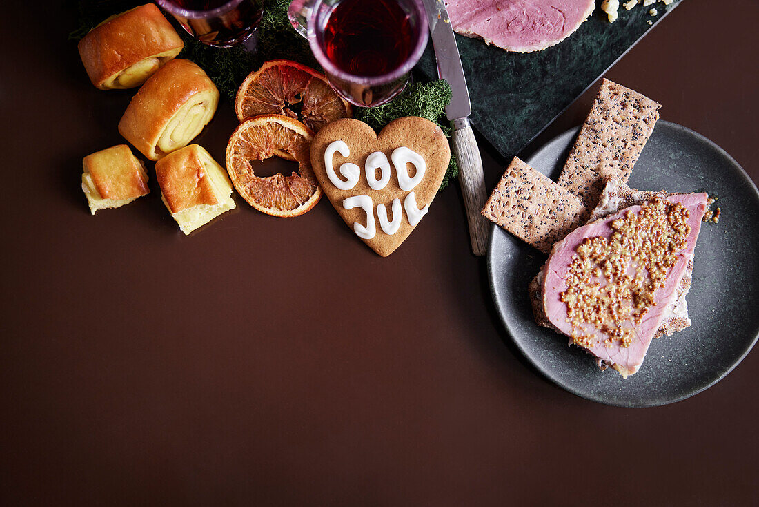 Christmas food and gingerbread cookie on table