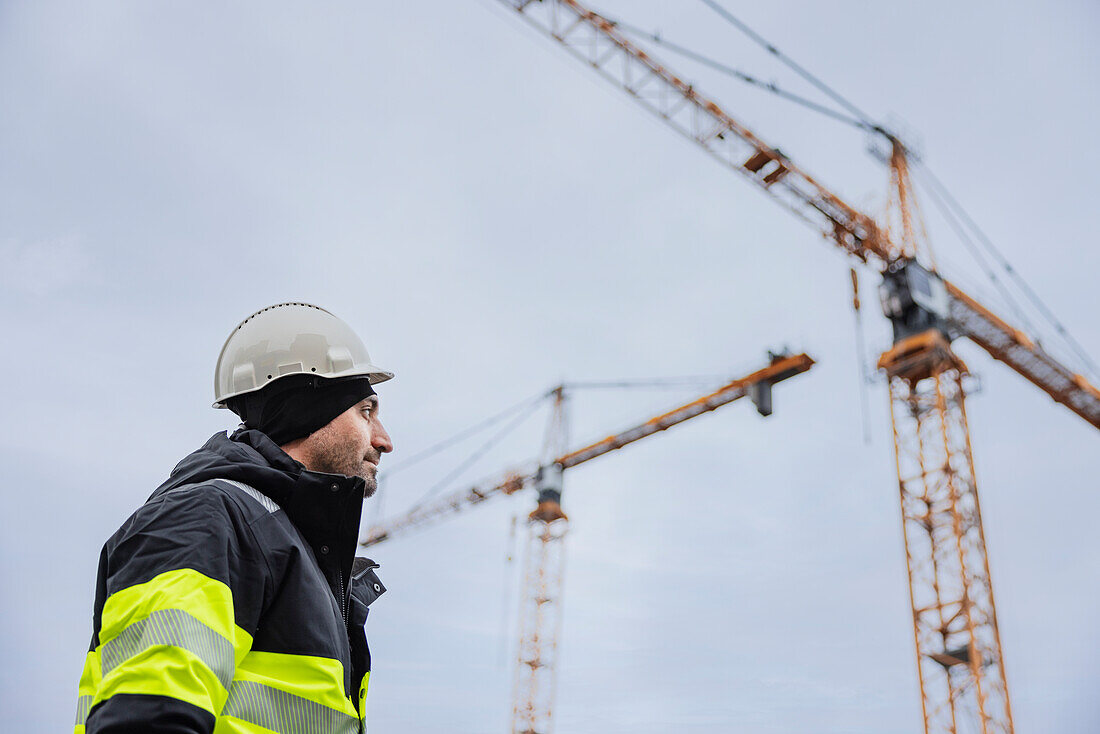 Engineer using standing at building site