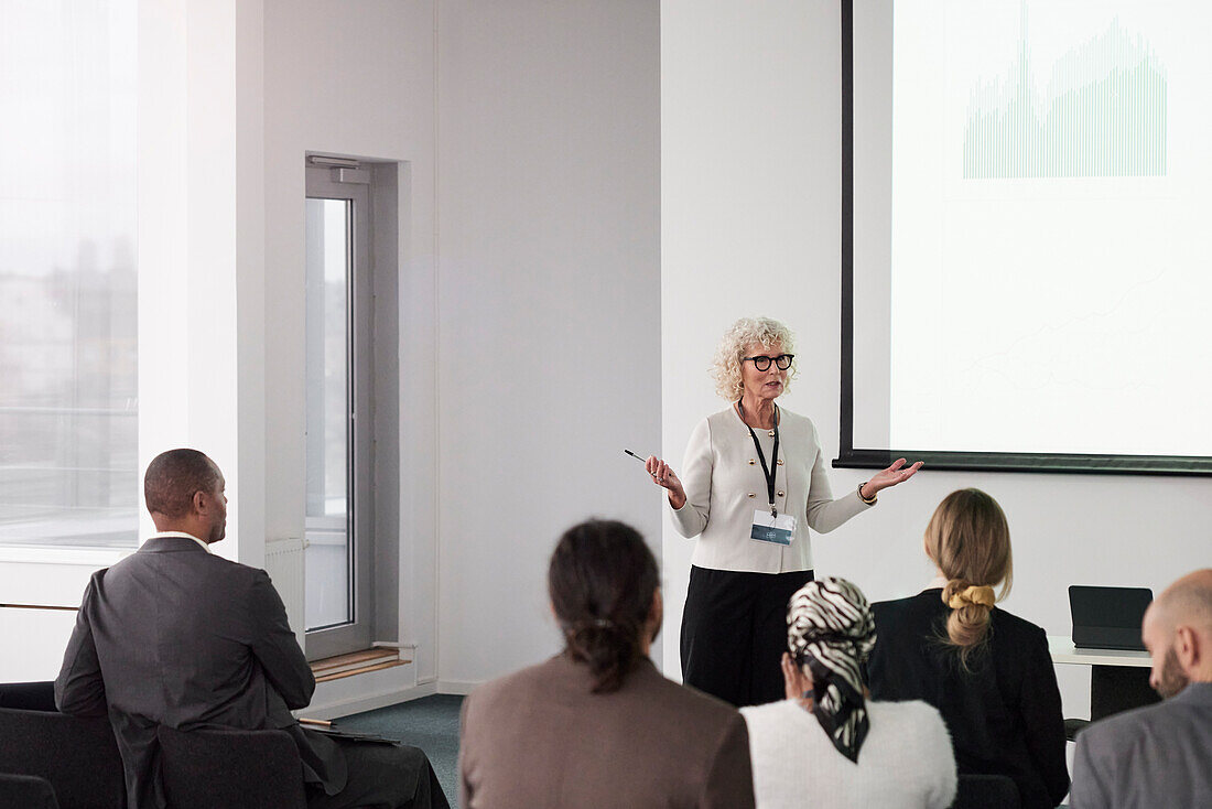 Woman having presentation during business seminar