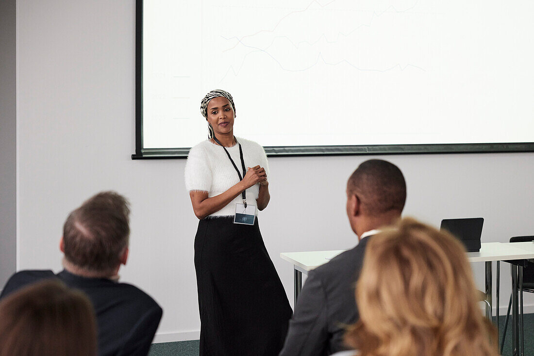 Woman having presentation during business seminar