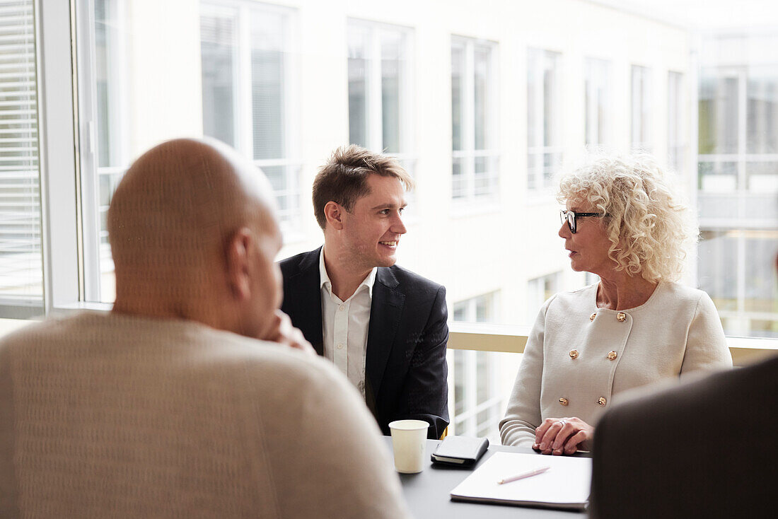 People talking during business meeting