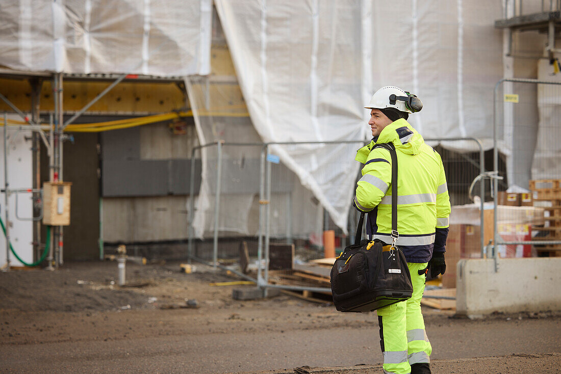 Rear view of engineer at building site