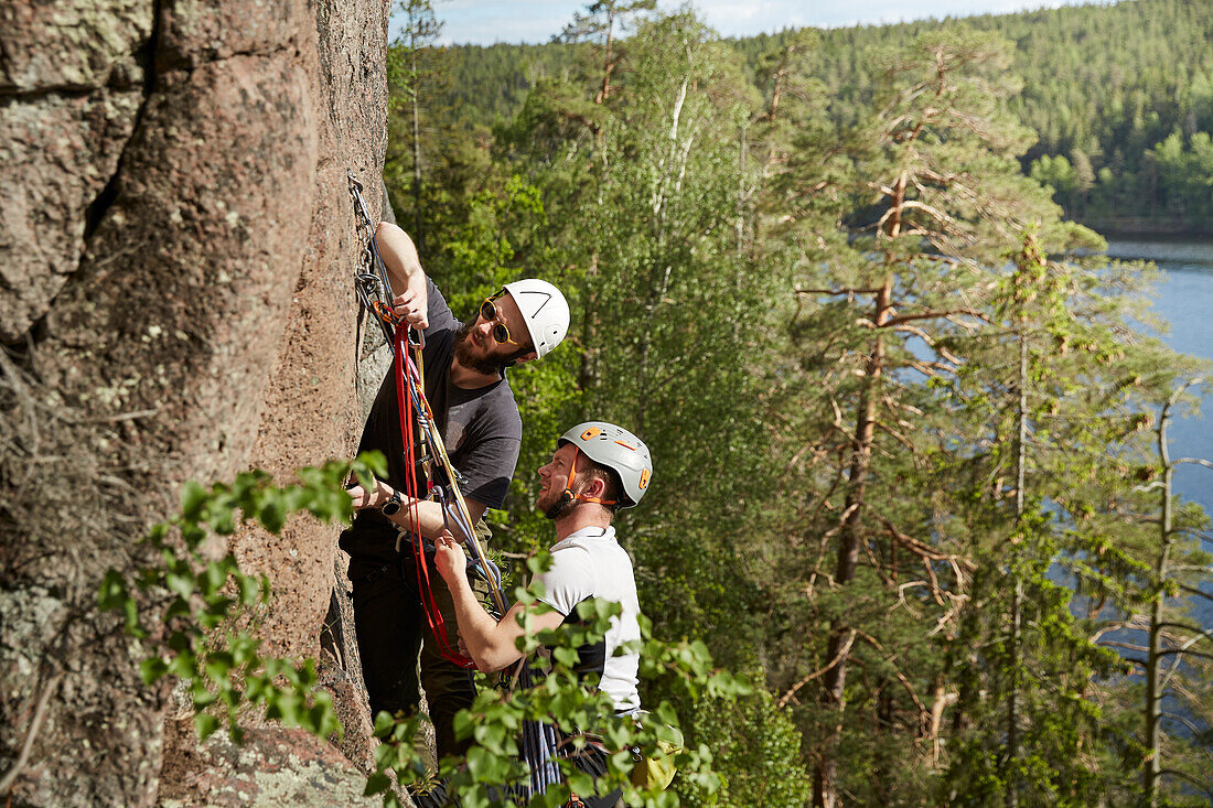 View of rock climbers on rock face