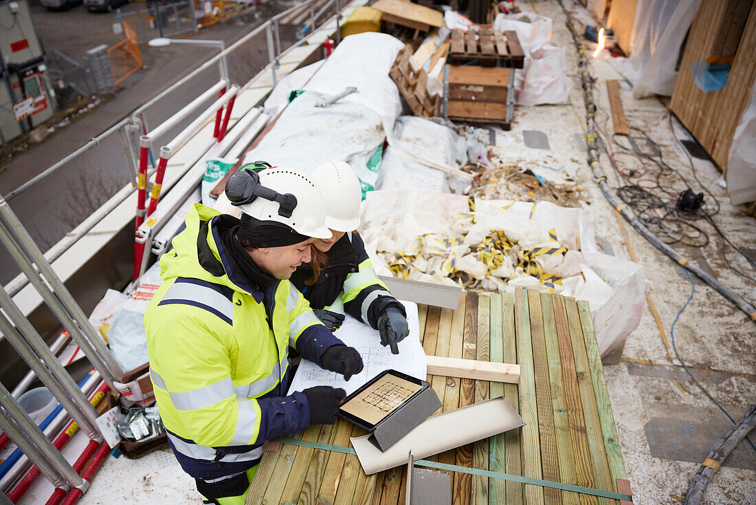 Engineers talking at building site