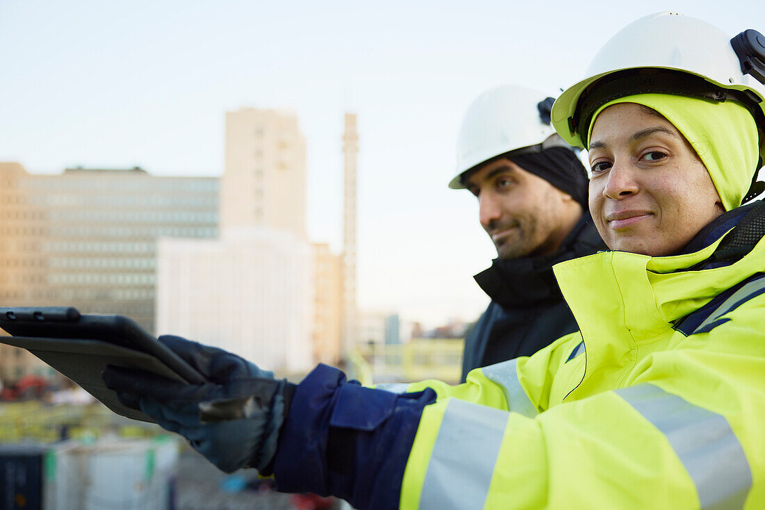 Two engineers working at construction site