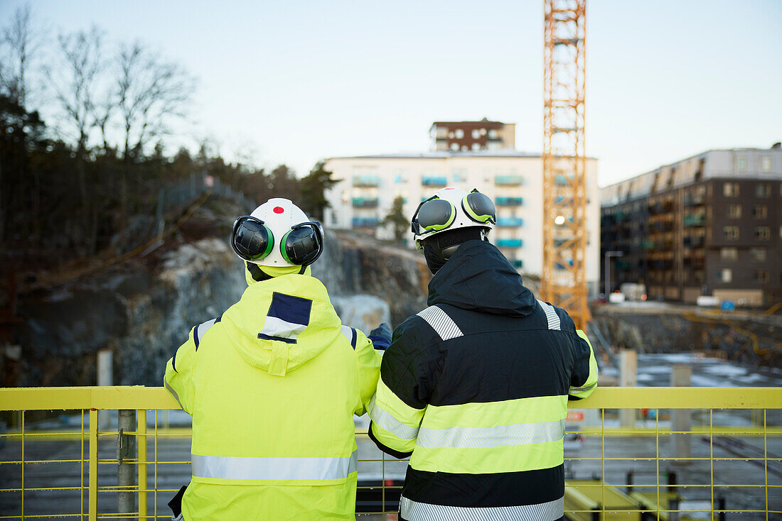 Two engineers working at construction site