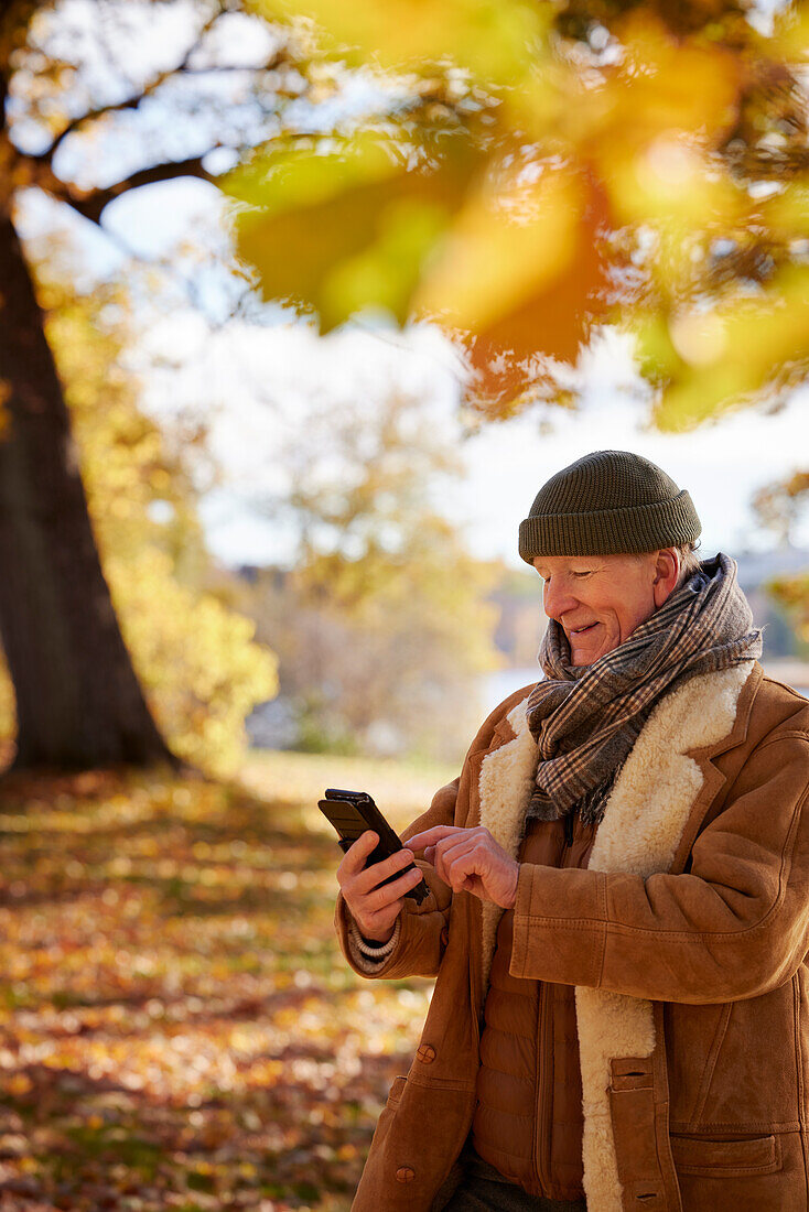 Senior man using cell phone