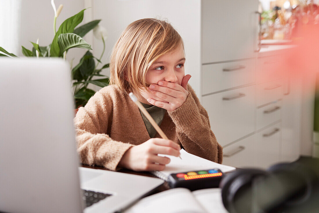 Girl doing homework at home