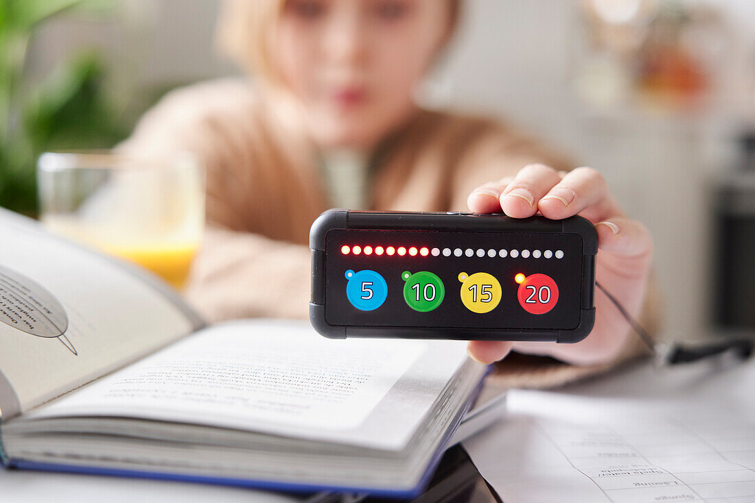 Child holding educational electronic game