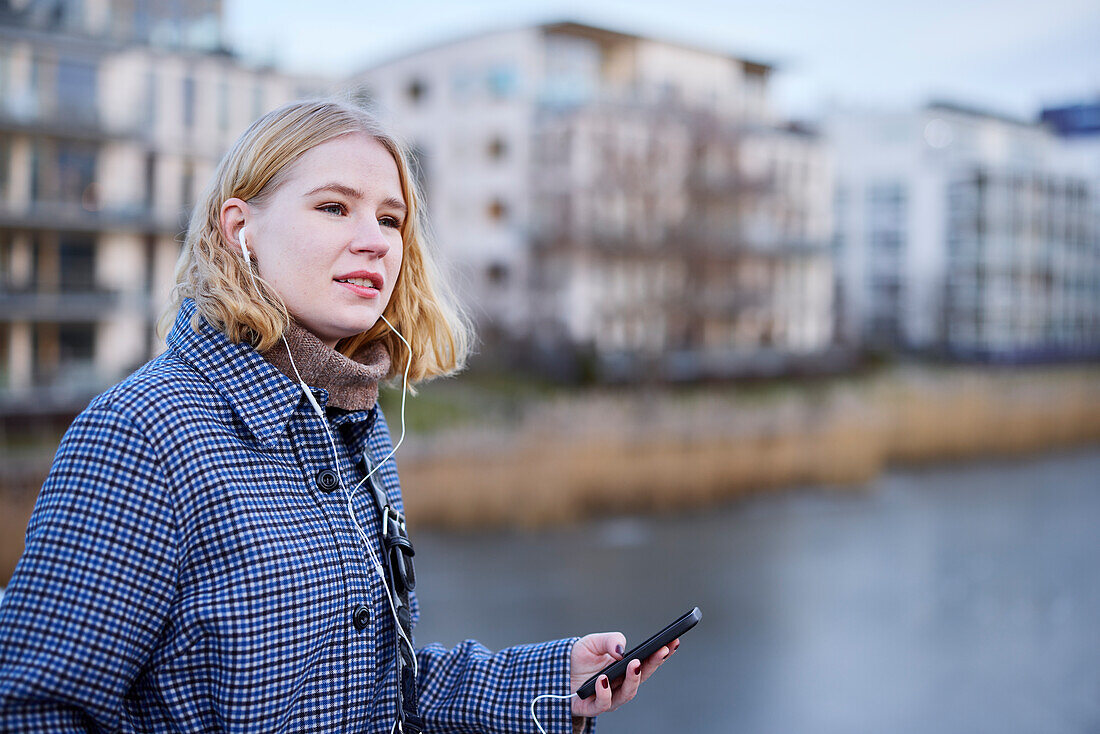 Smiling woman using cell phone