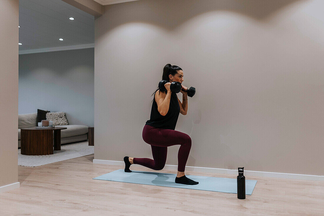 View of woman exercising at home