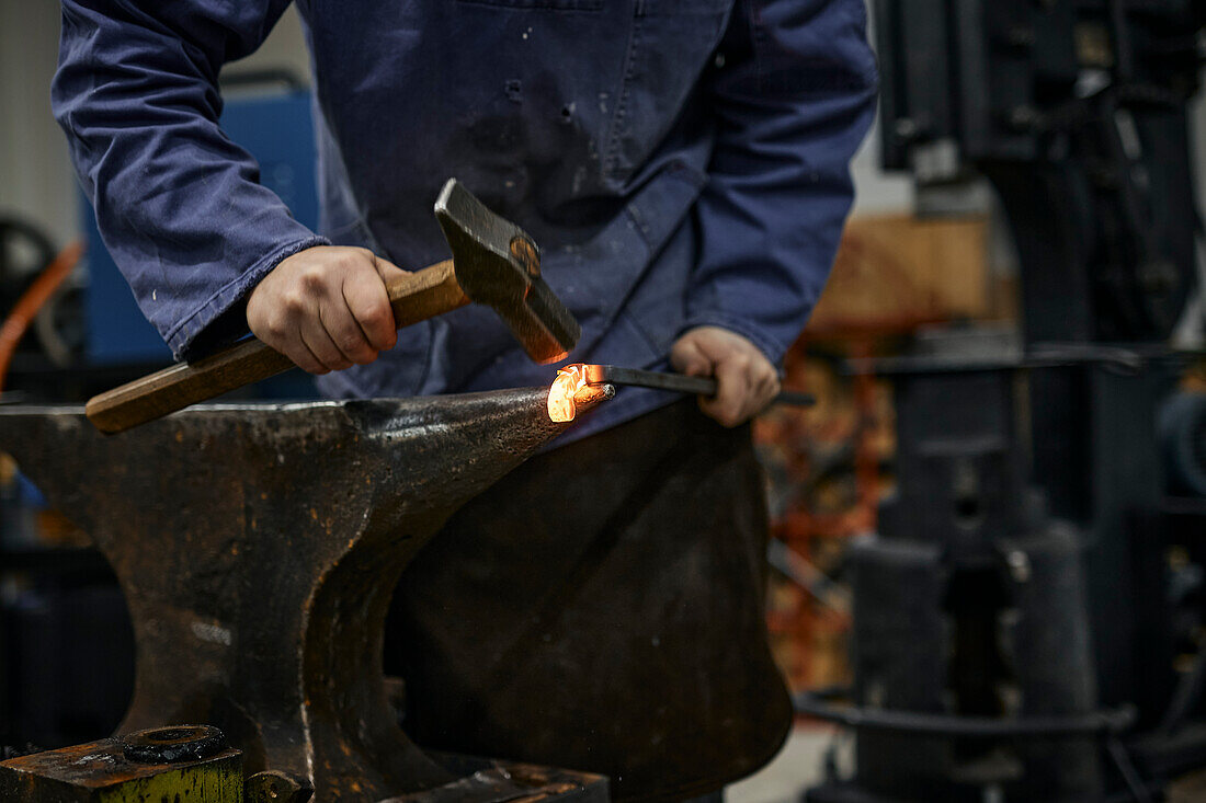 Blacksmith working in his workshop