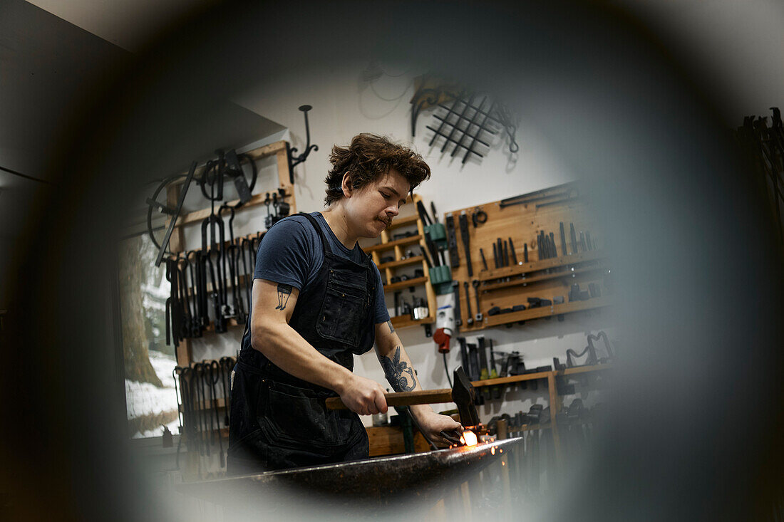 Blacksmith working in his workshop