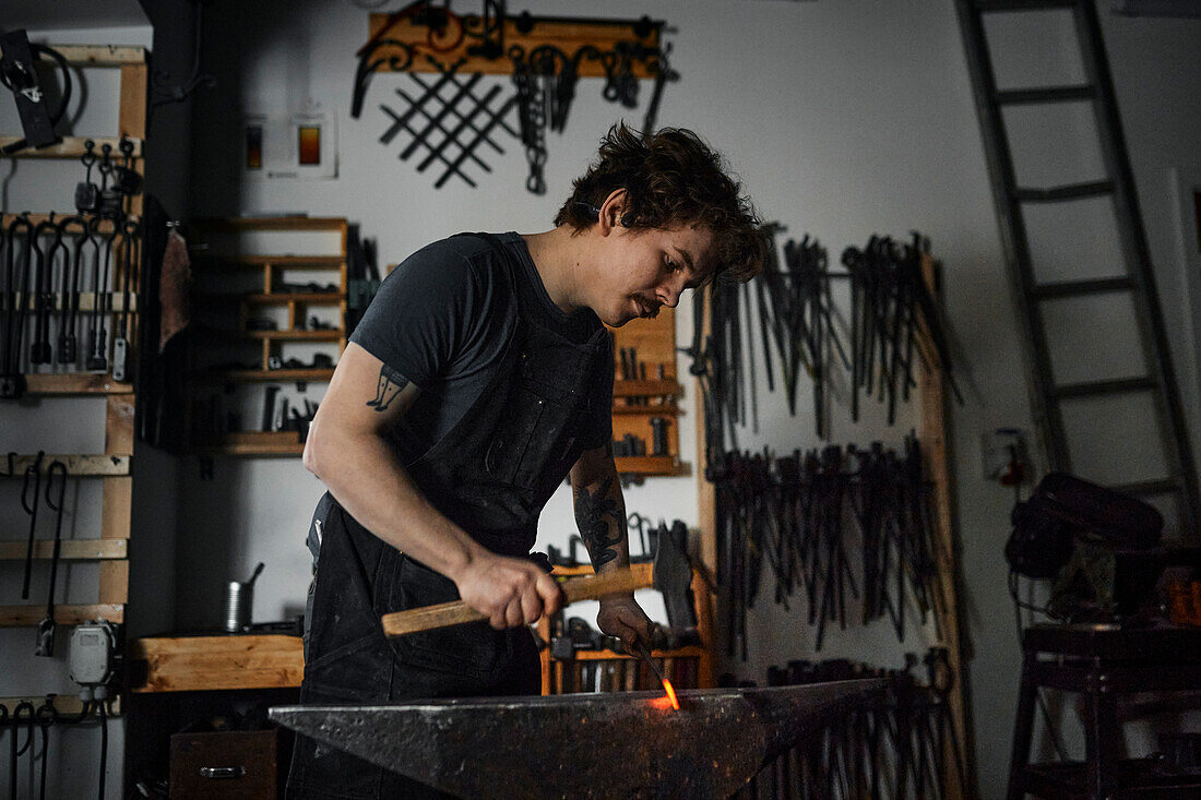 Blacksmith working in his workshop