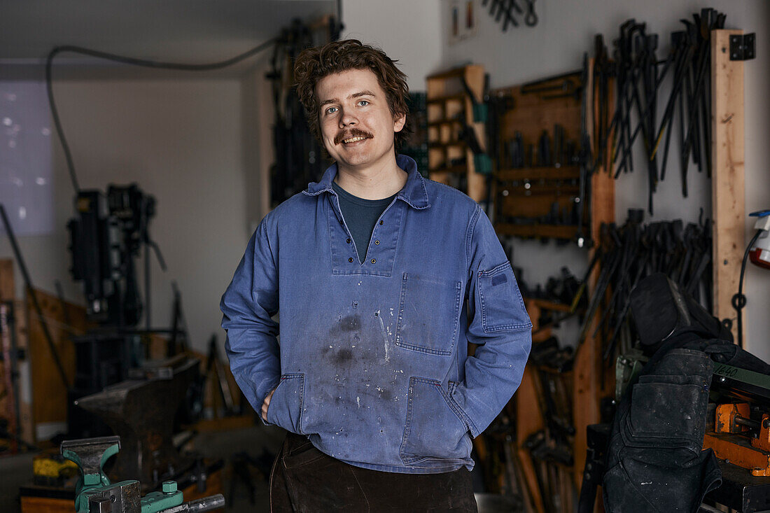 Blacksmith posing in his workshop