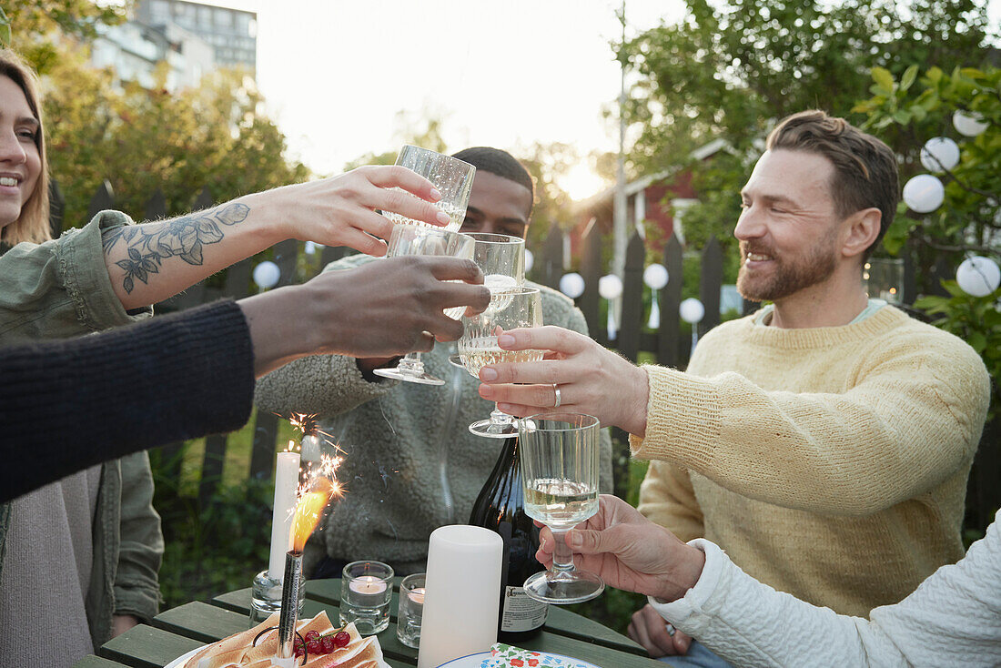 Happy friends having party in garden