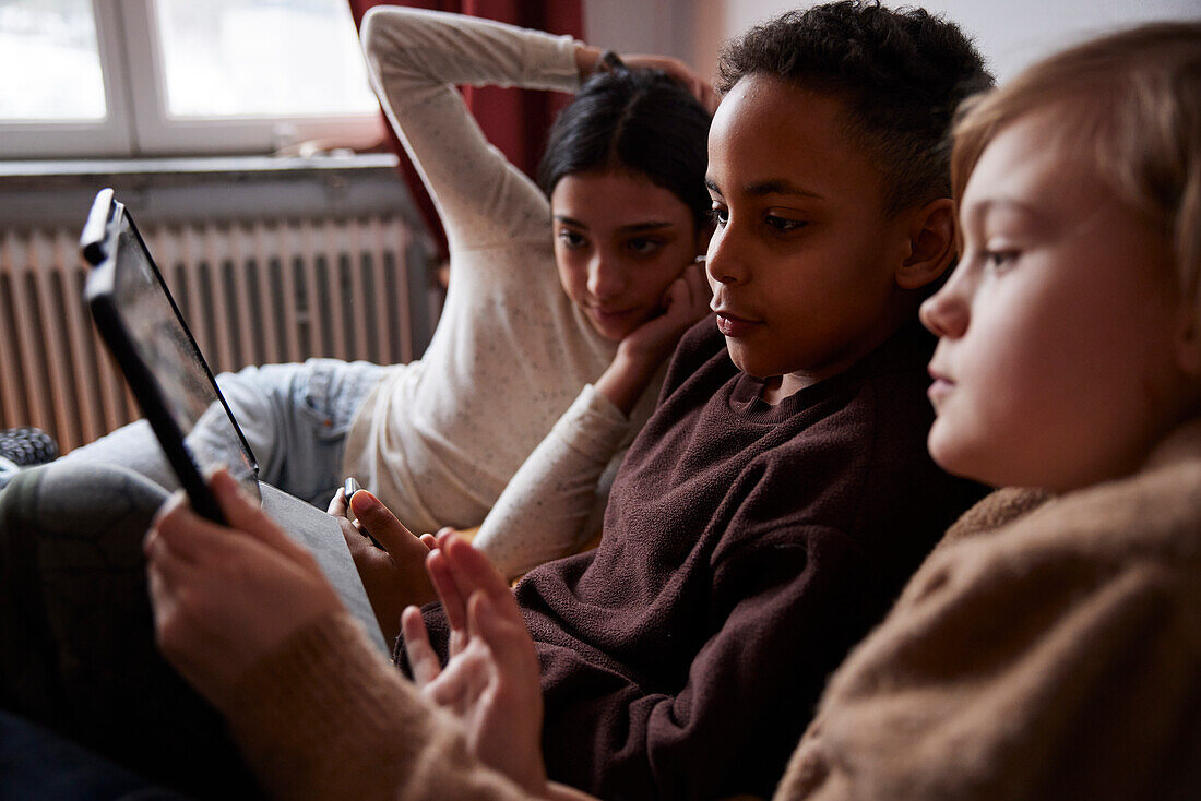 Children using digital tablet at home