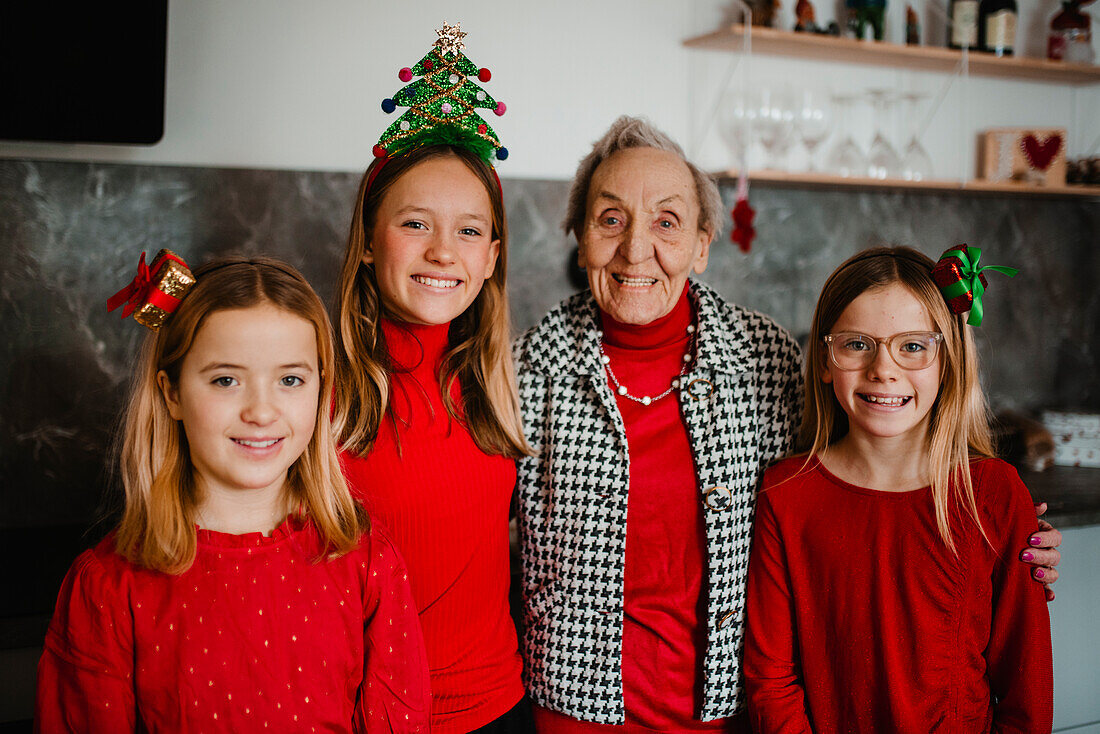 Christmas portrait of grandmother with granddaughters