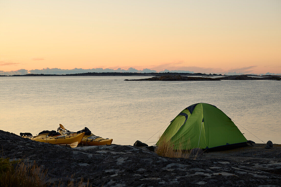 View of tent at rocky coast
