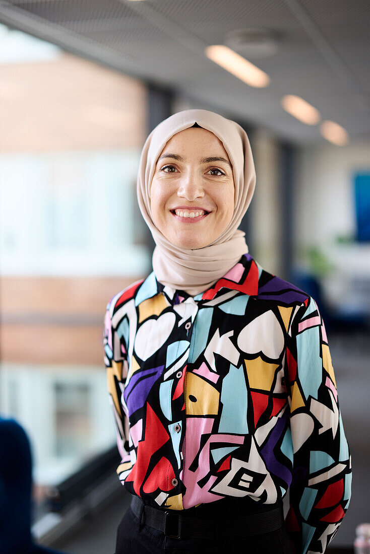 Portrait of smiling businesswoman in hijab