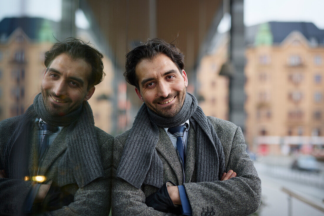 Portrait of smiling businessman outdoors