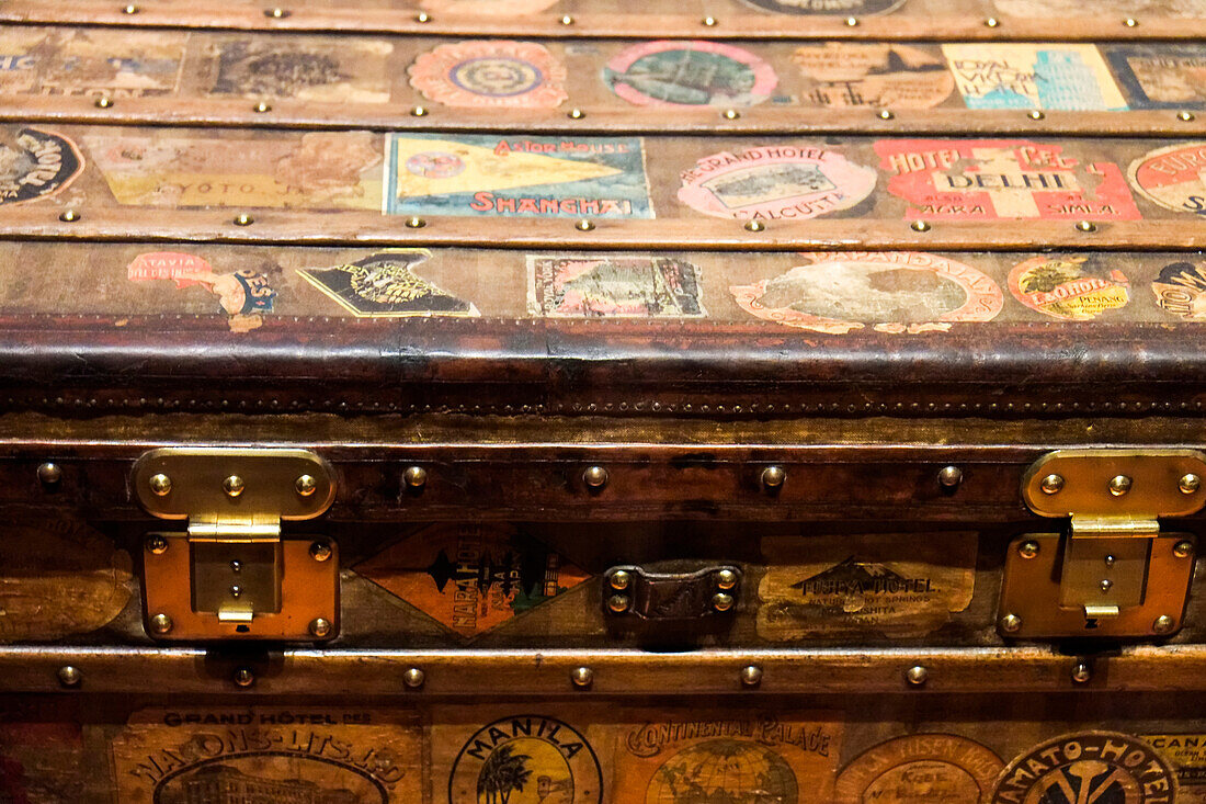 Old steamer trunk covered with stickers of various destinations.