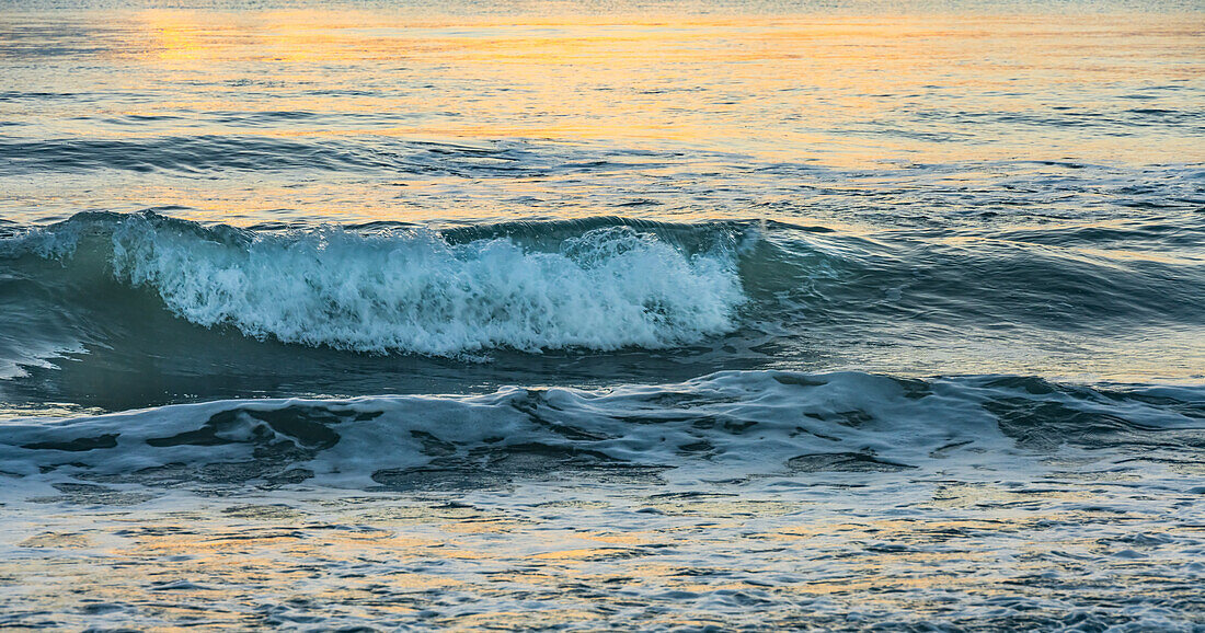 Ocean waves at sunset