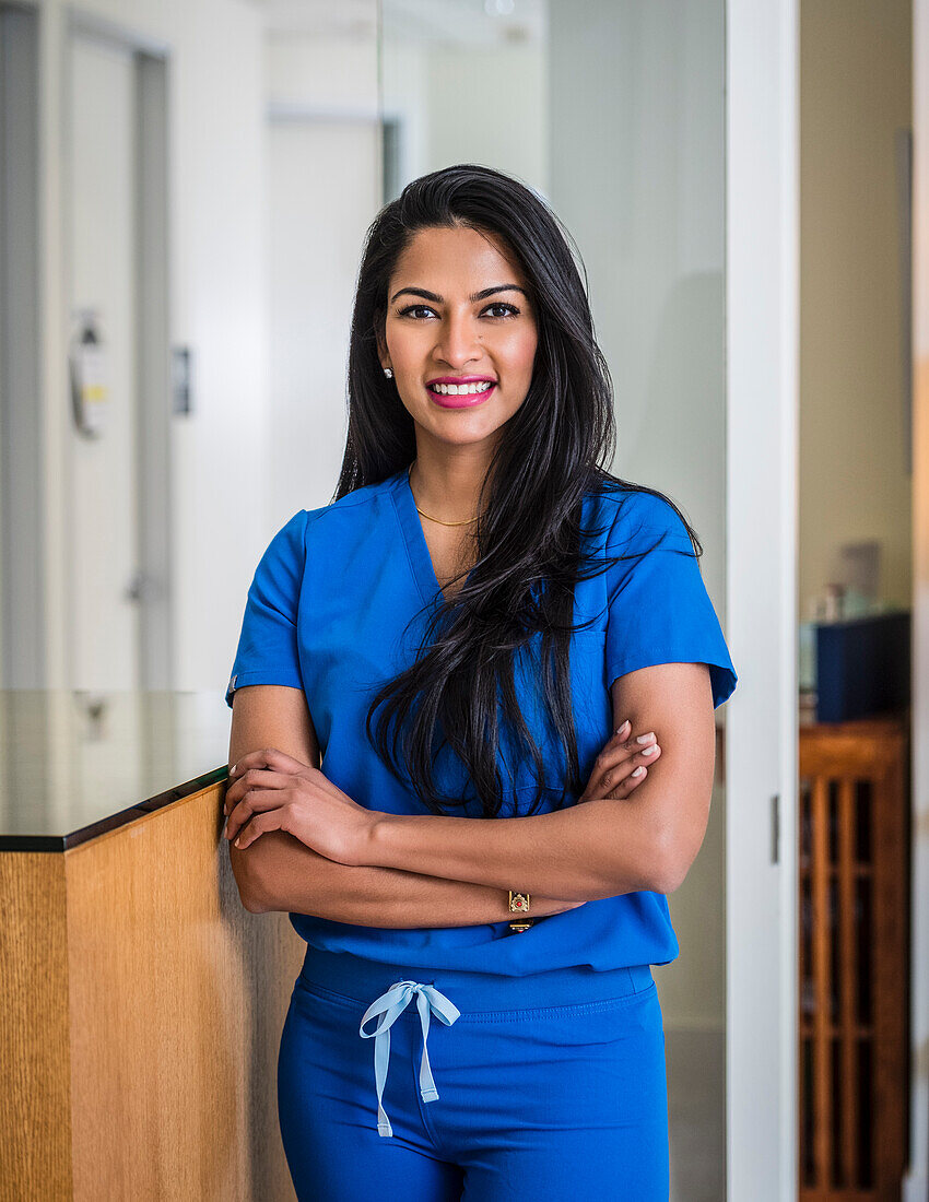 Portrait of female doctor at reception desk