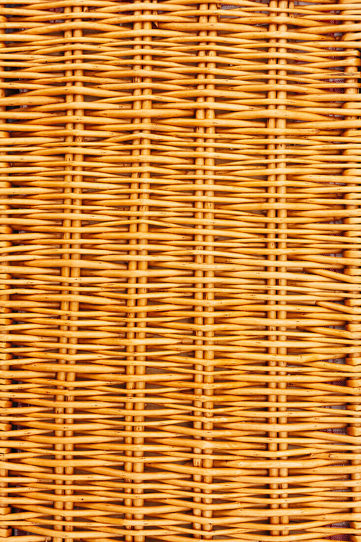 Close-up of closed wicker picnic basket 