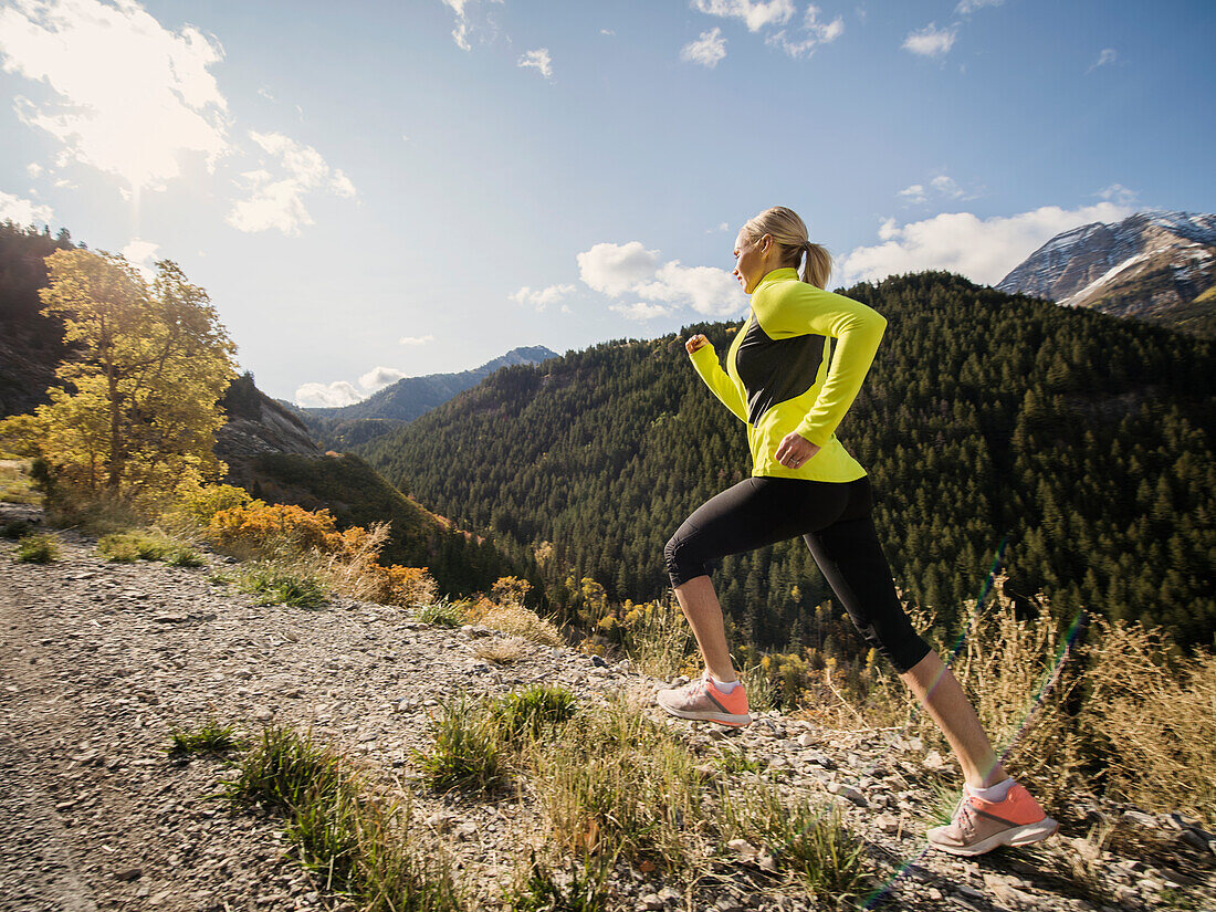 United States, Utah, American Fork, Woman jogging in mountain landscape