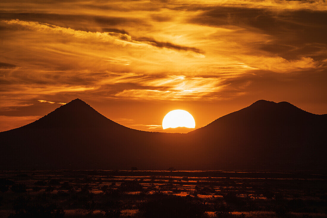 United States, New Mexico, Cerrillos, Silhouette of mountains at sunset over High Desert 