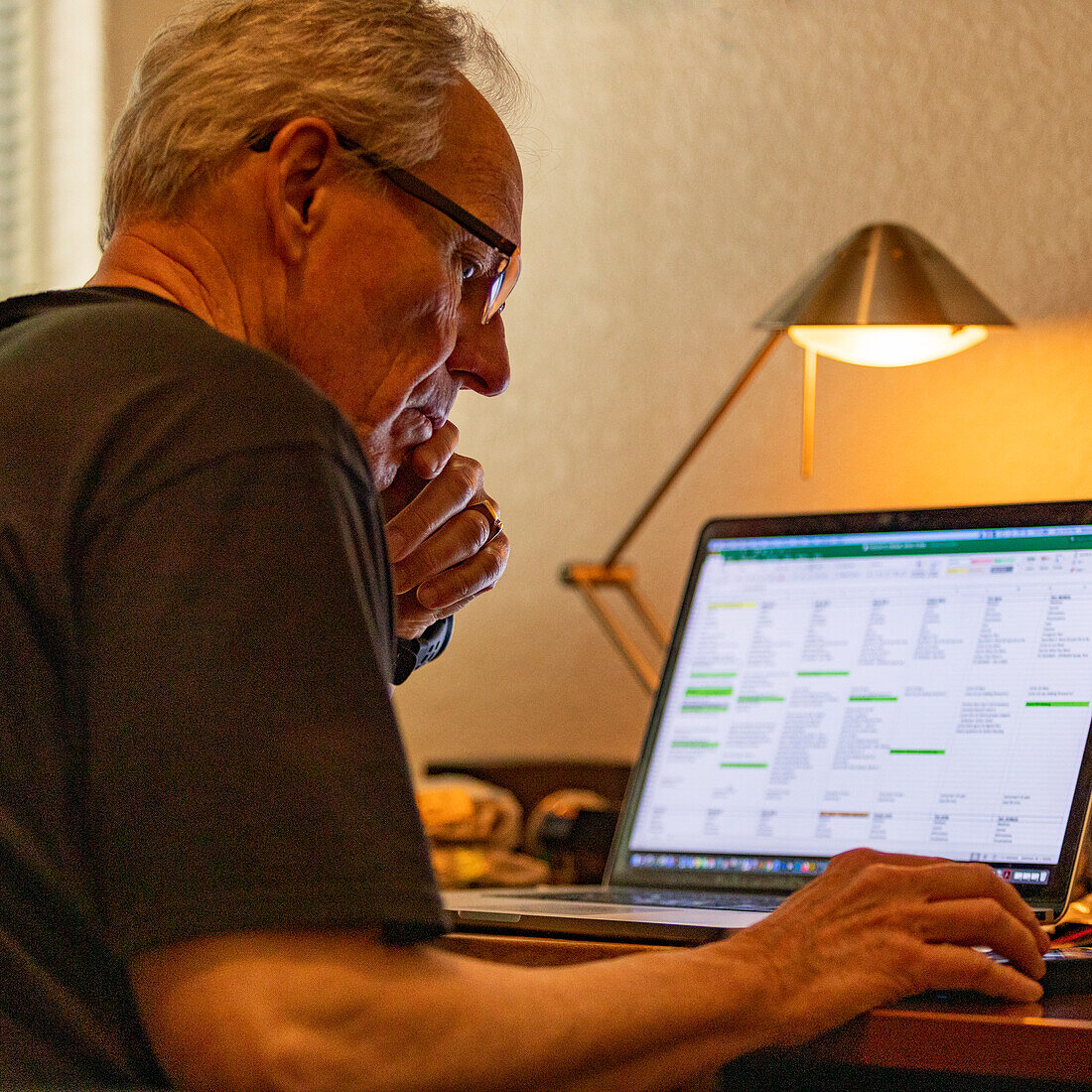 Senior man working on laptop