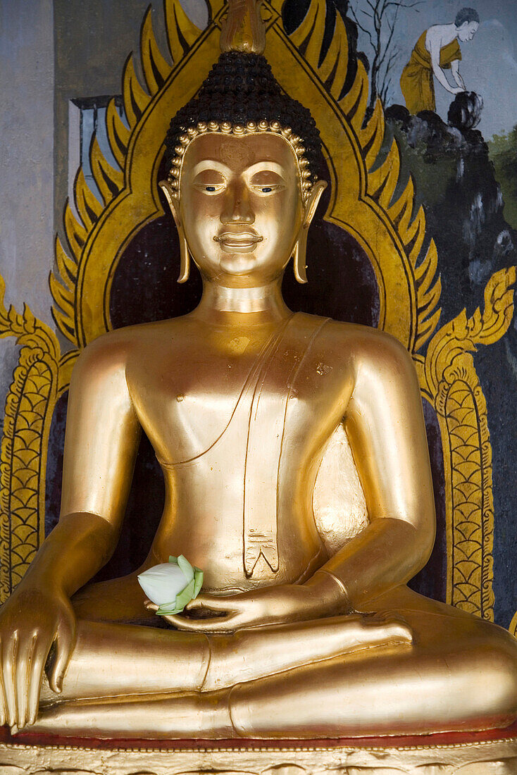 Thailand, Bangkok, Wat Phra Buddhist Temple, Buddha statue with lotus flower