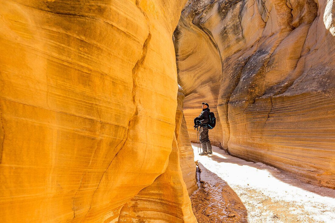 USA, Utah, Escalante, Man hiking in slot canyon in Grand Staircase-Escalante National Monument