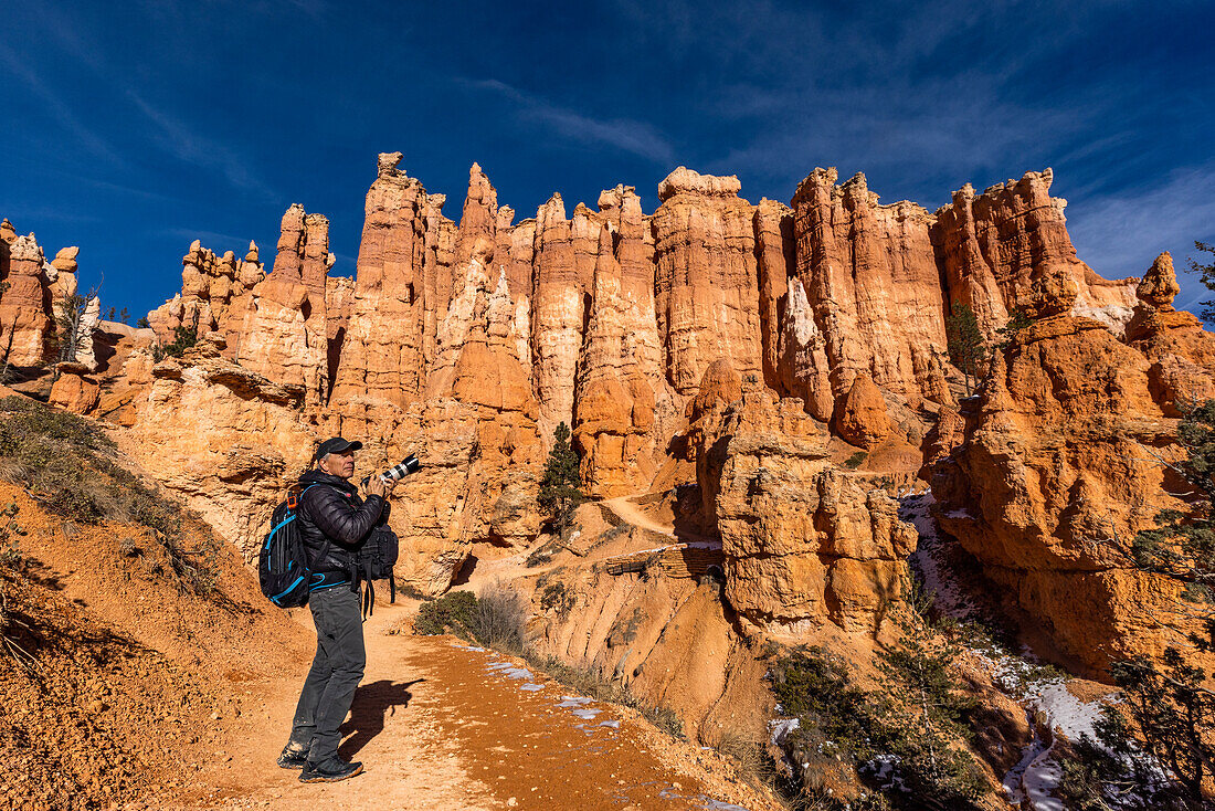 United States, Utah, Senior photographer photographing in Zion National Park