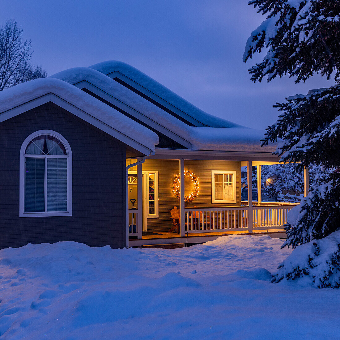United States, Idaho, Bellevue, Snow covered house with porch lights