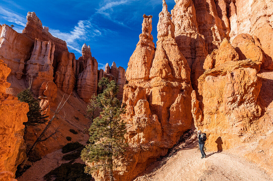 United States, Utah, Bryce Canyon National Park, Senior hiker walking in rocky landscape