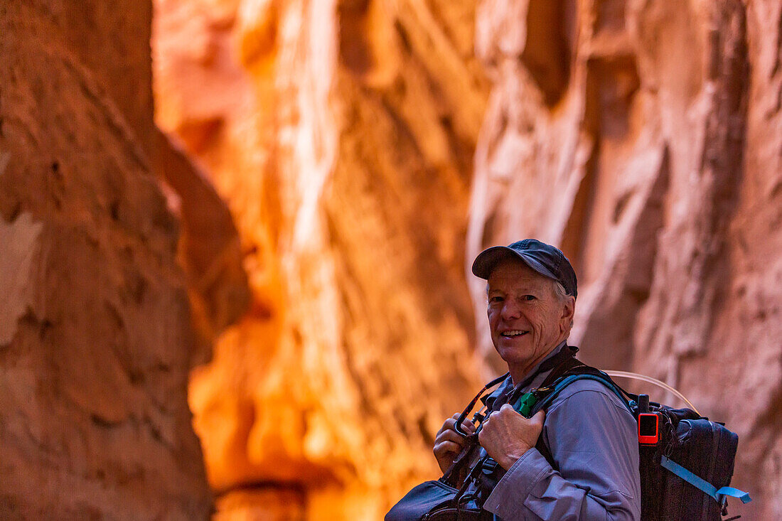 United States, Utah, Escalante, Senior hiker exploring rock formations in Kodachrome Basin State Park near Escalante Grand Staircase National Monument
