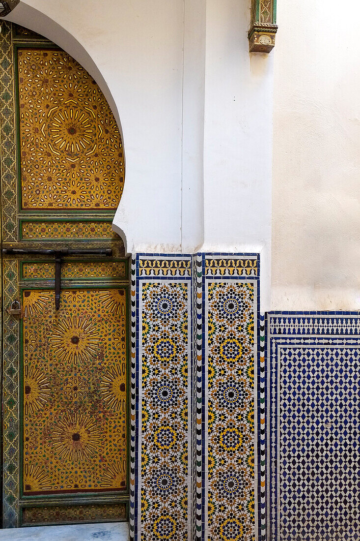 Africa, Morocco, Traditionally decorated doors and tilework in medina