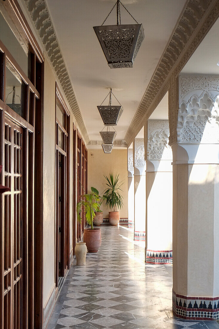 Africa, Morocco, Walkway with Moorish decor at local riad