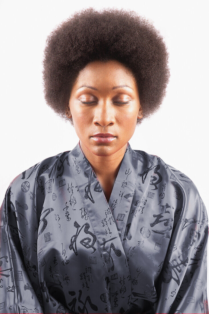 Studio portrait of woman with eyes closed