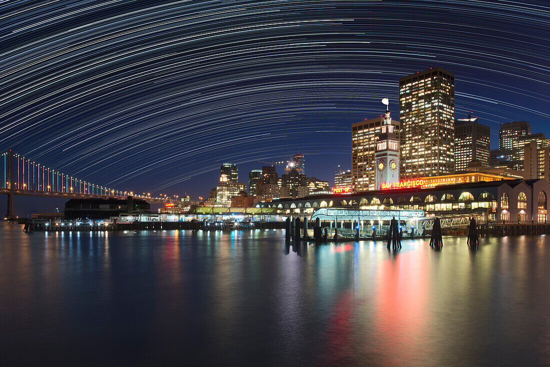 USA, California, San Francisco. Composite of star trails above downtown