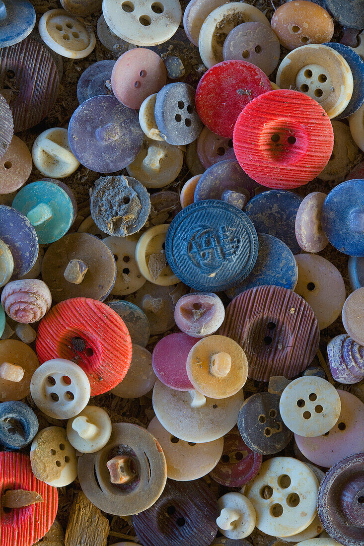 Pile of button that would have been used on sweaters produced in the Roosevelt sweater Mill had it not closed in 1988.