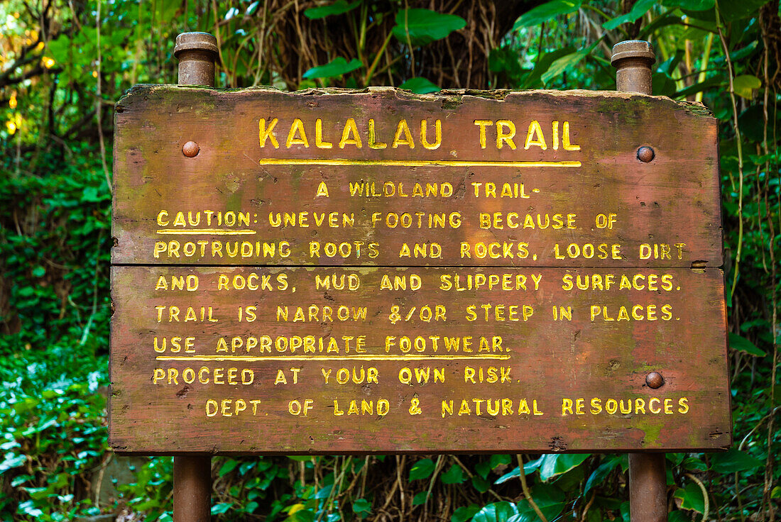 Kalalau Trail sign at the Ke'e Beach trailhead, Na Pali Coast, Island of Kauai, Hawaii, USA
