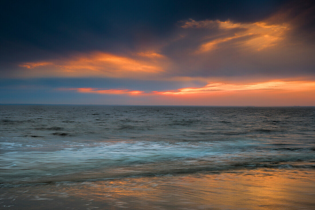 USA, New Jersey, Cape May National Seashore. Overcast sunrise on shore