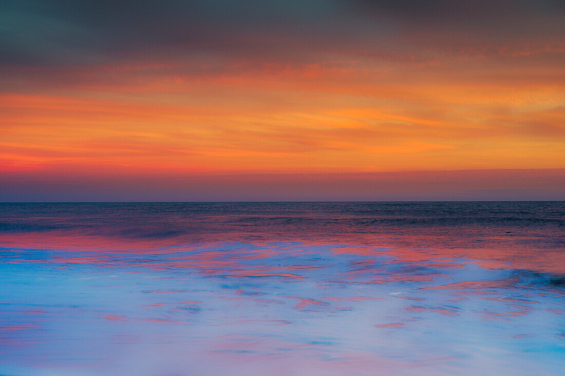 USA, New Jersey, Cape May National Seashore. Sunset on ocean shore