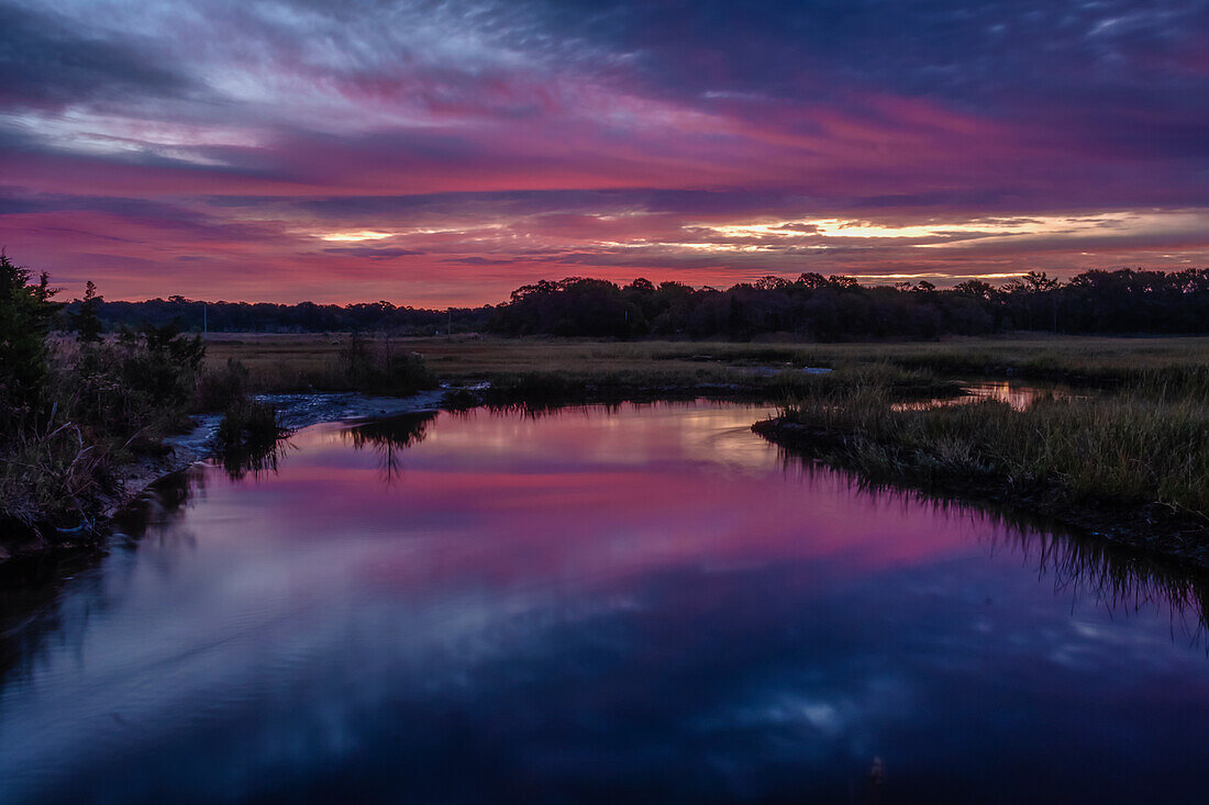 USA, New Jersey, Cape May National Seashore. Sunrise on creek